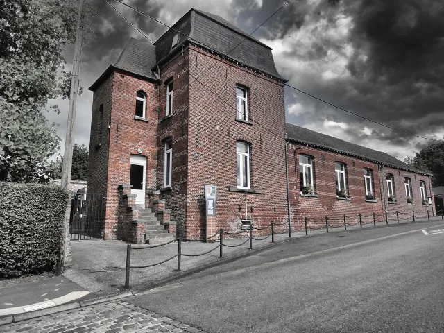An exterior view of a school building representing educational institutions affected by recent closures.