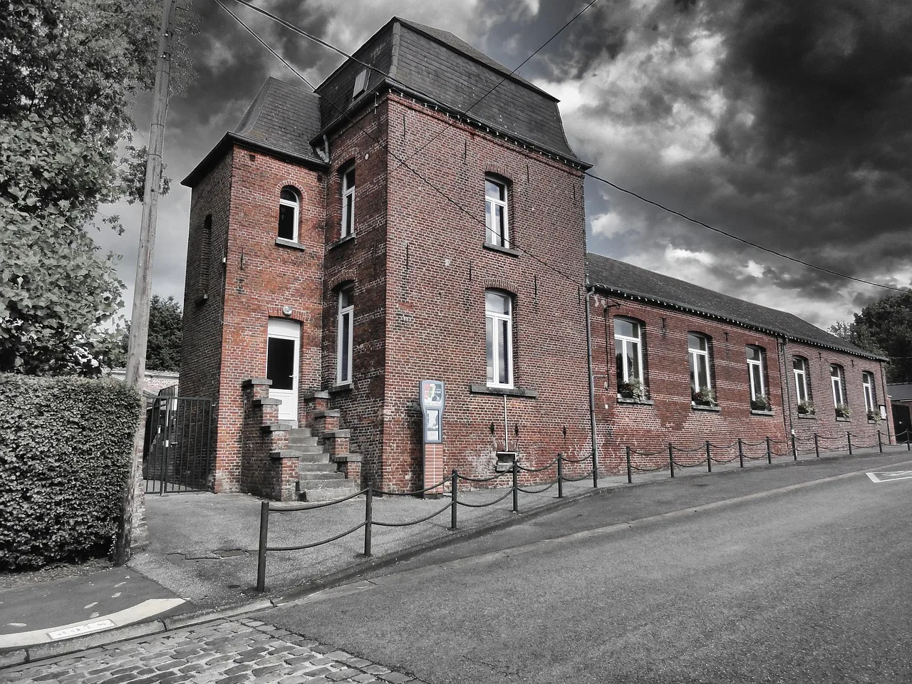 An exterior view of a school building representing educational institutions affected by recent closures.