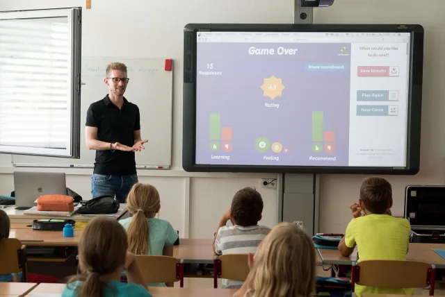 A modern classroom setting representing global education and training market growth.