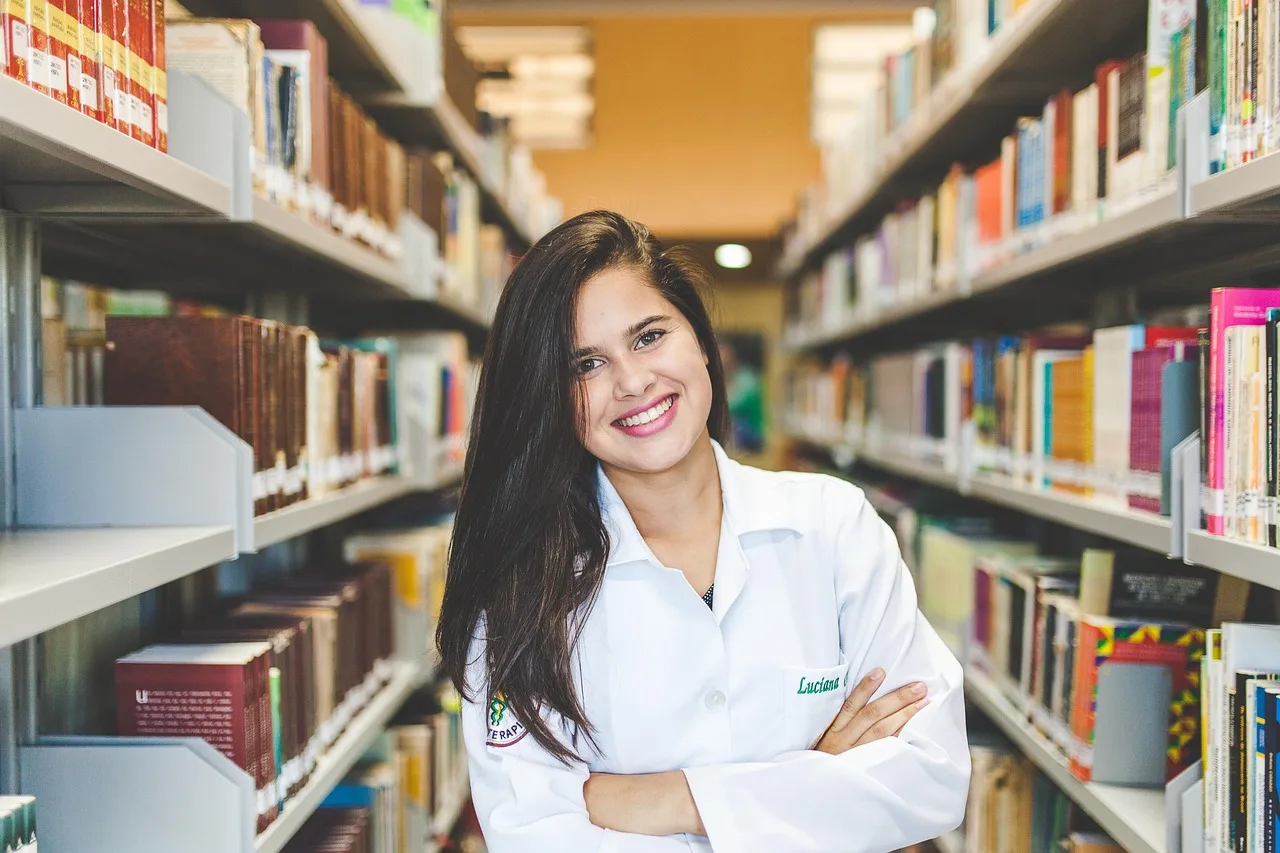 Pakistani PhD scholars studying in a university library for international fellowships.