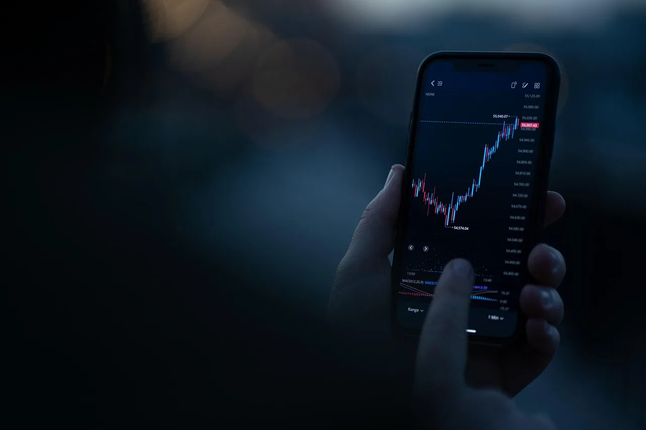 A smartphone displaying a digital stock trading and finance application screen.
