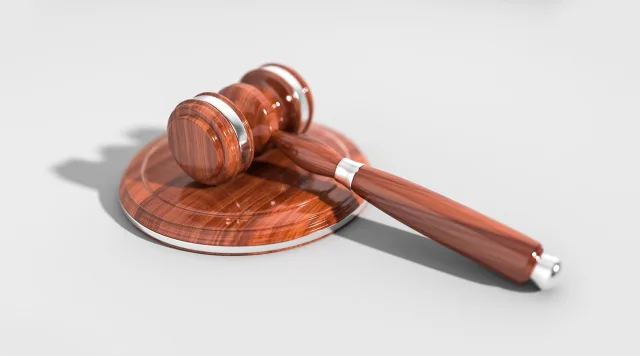 A professional photo representing a legal hearing or court proceeding in Pakistan.