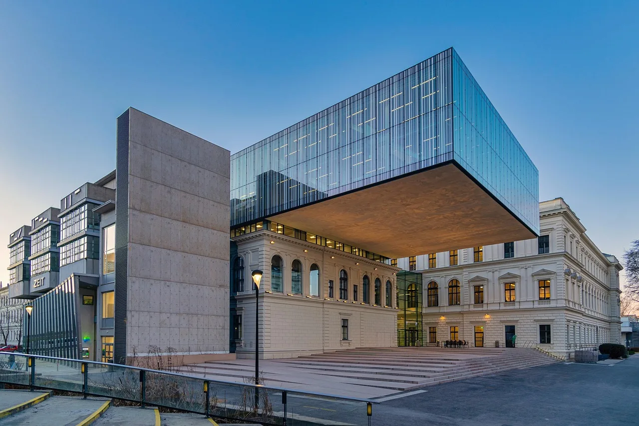 Students walking near a modern university building representing global higher education