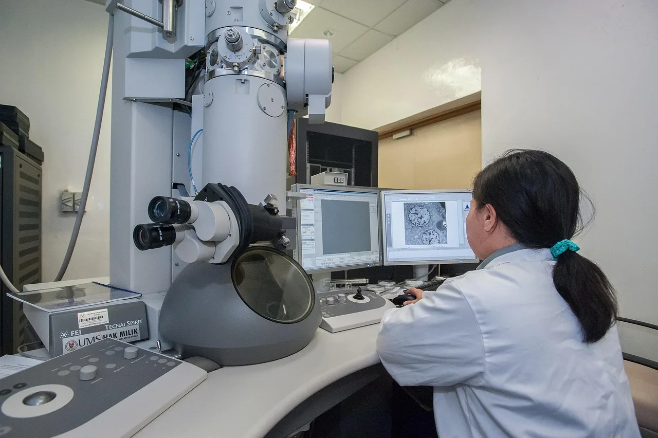 Students working in a modern university computer science laboratory focused on artificial intelligence research.